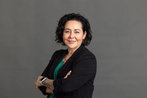 Kristelia Garcia in a professional portrait wearing a black blazer