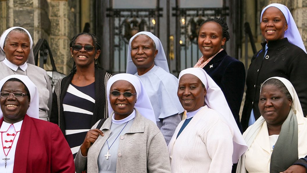 A group of African Catholic sisters on the steps of Healy Hall