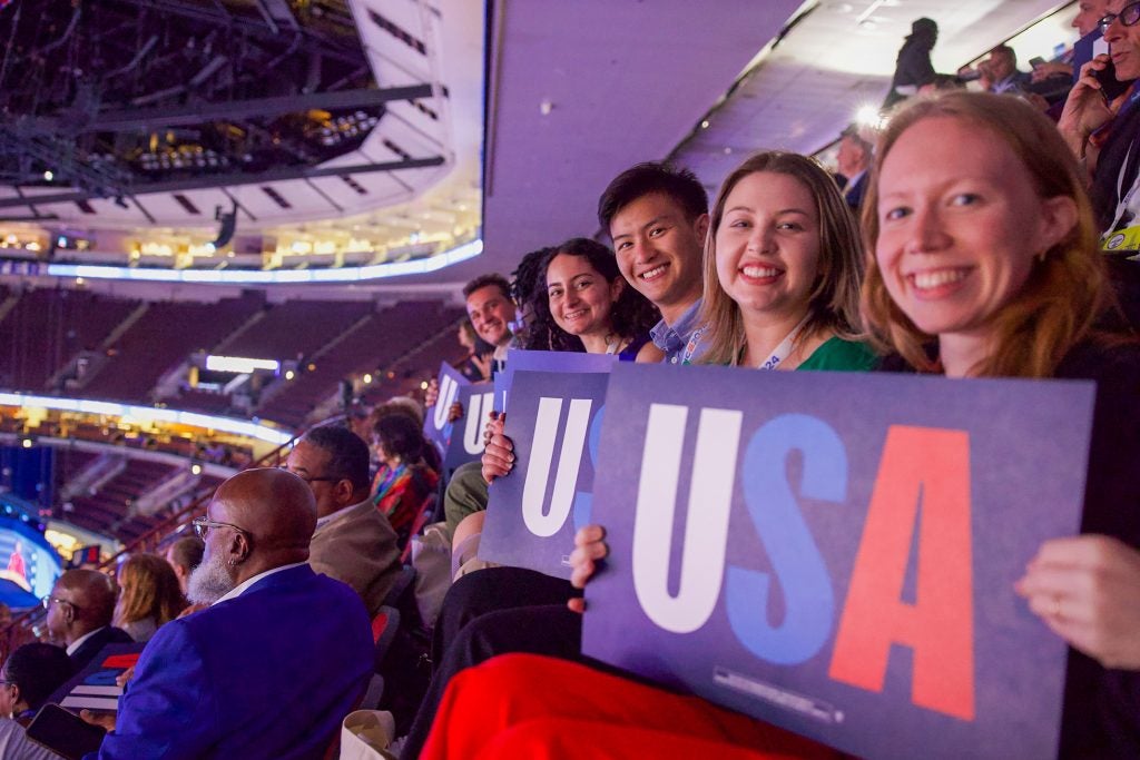 Students holding USA signs at the DNC