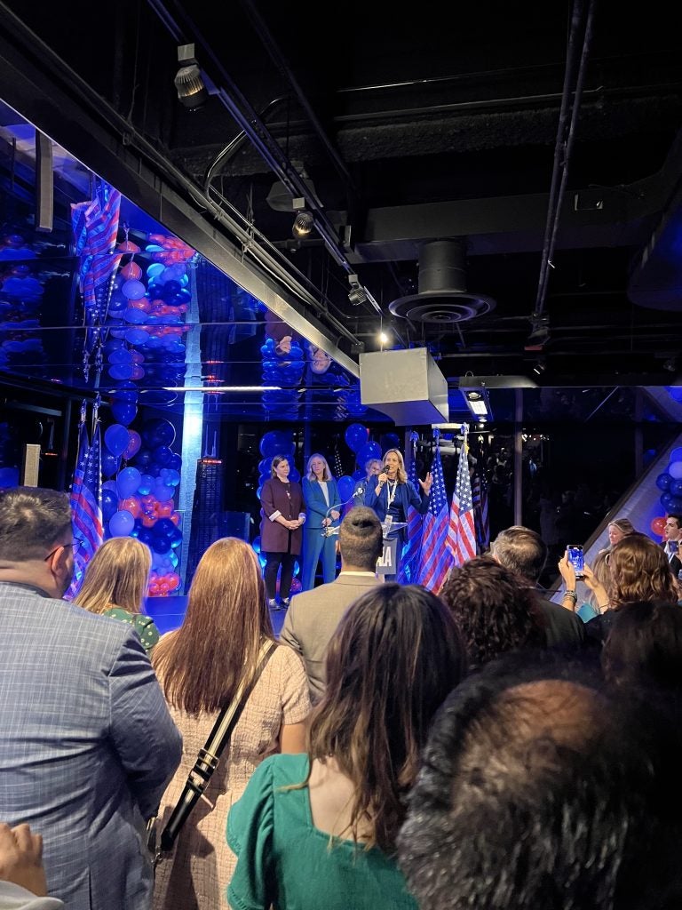 A crowd looking at someone speak at the DNC