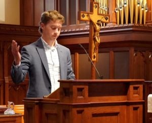 Luke Hughes lectoring in Dahlgren Chapel.