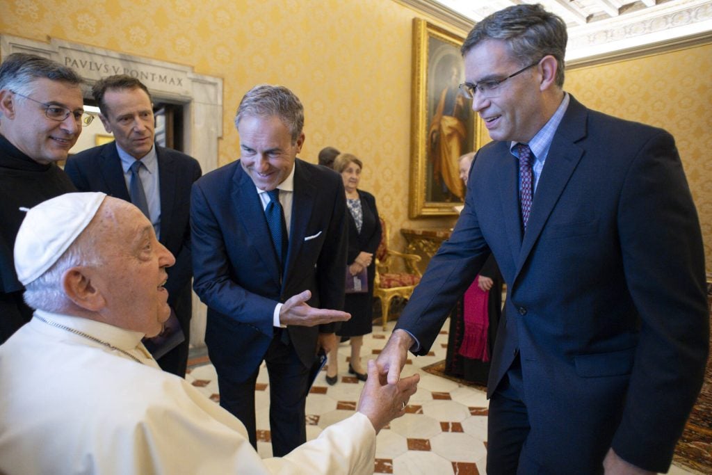 Dr. Michael Donnelly greets Pope Francis at the Vatican.