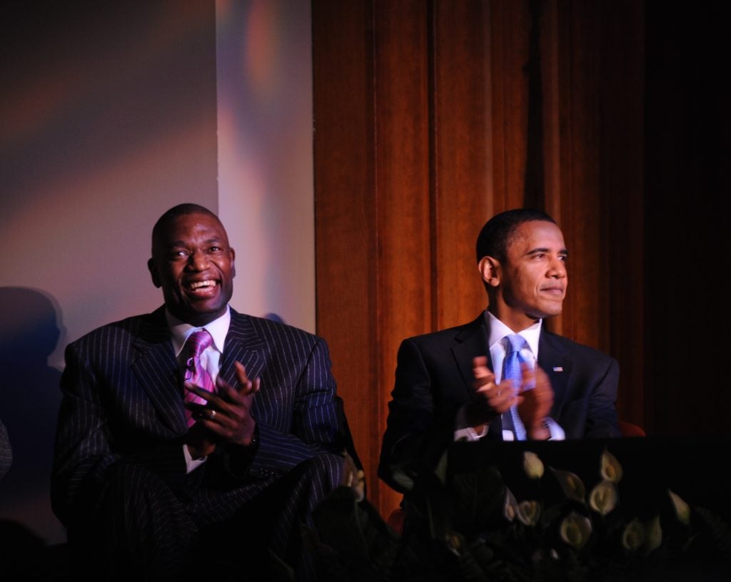 Mutombo sitting next to President Obama