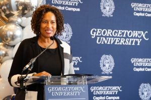 Muriel Bowser speaking at a podium with Georgetown logos behind her