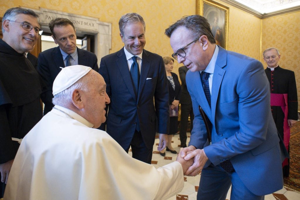 Norm Beauchamp shakes Pope Francis's hand.