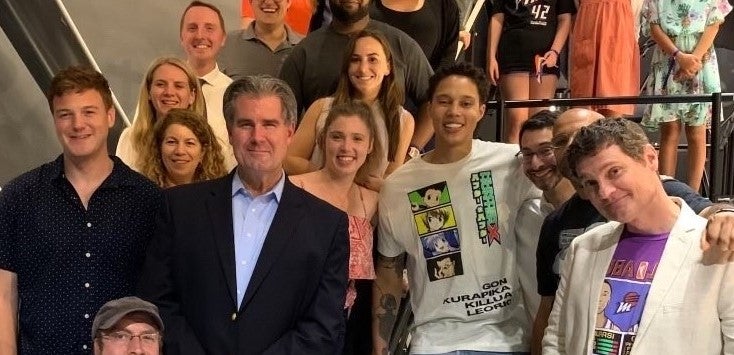 Gillen with Griner and others on his team at a WNBA game