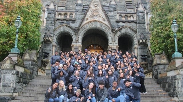 GSP students in matching shirts on Healy Steps