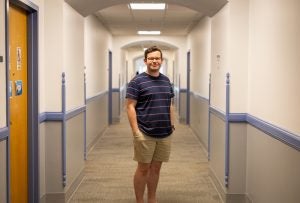 Troy standing in a hallway in Copley