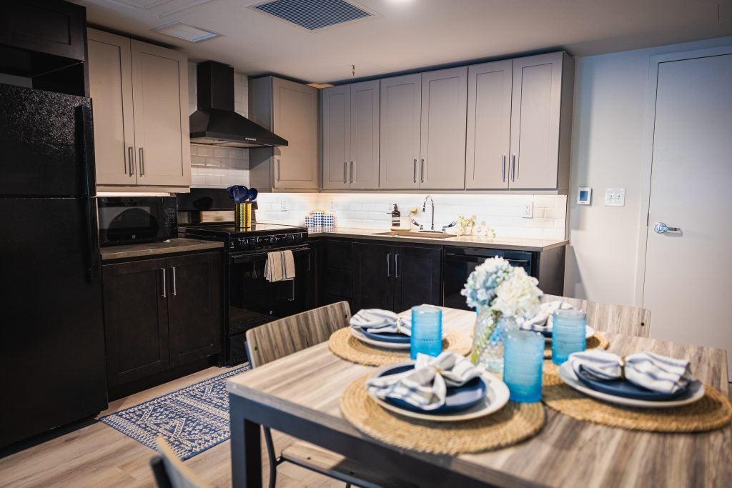 A kitchen with a set table.