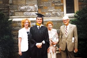 Gillen in graduation robes with his family