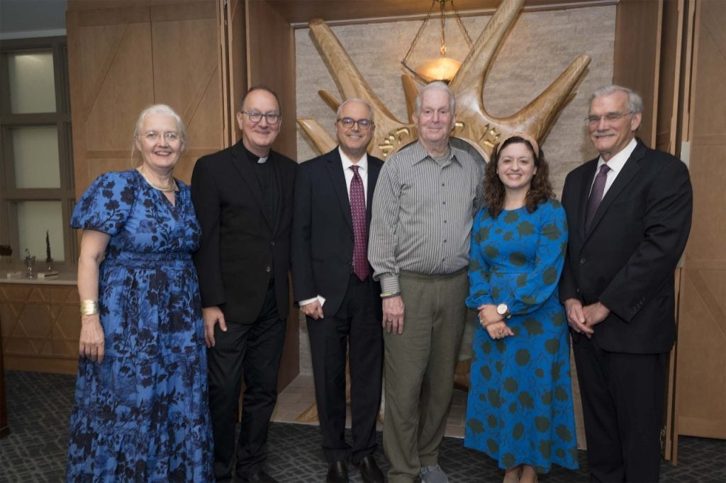 Six university leaders standing in front of the ark