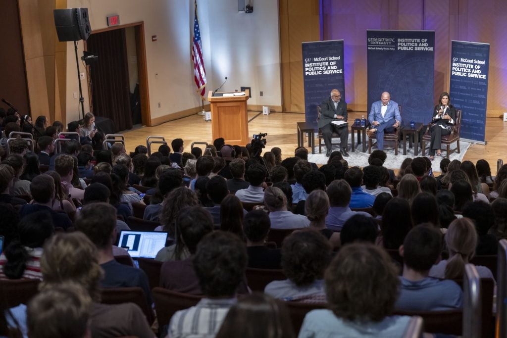 A crowd in Lohrfink Auditorium watch at Haley speaks