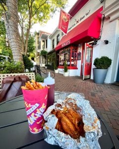 Wings and fries on a table in Georgetown neighborhood