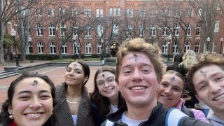 Luke and other students with ashes on foreheads for Ash Wednesday