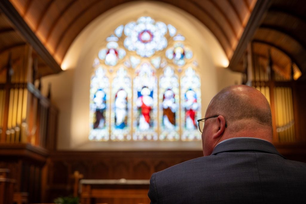 Back of Wickman's head as he looks toward the altar in Dahlgren