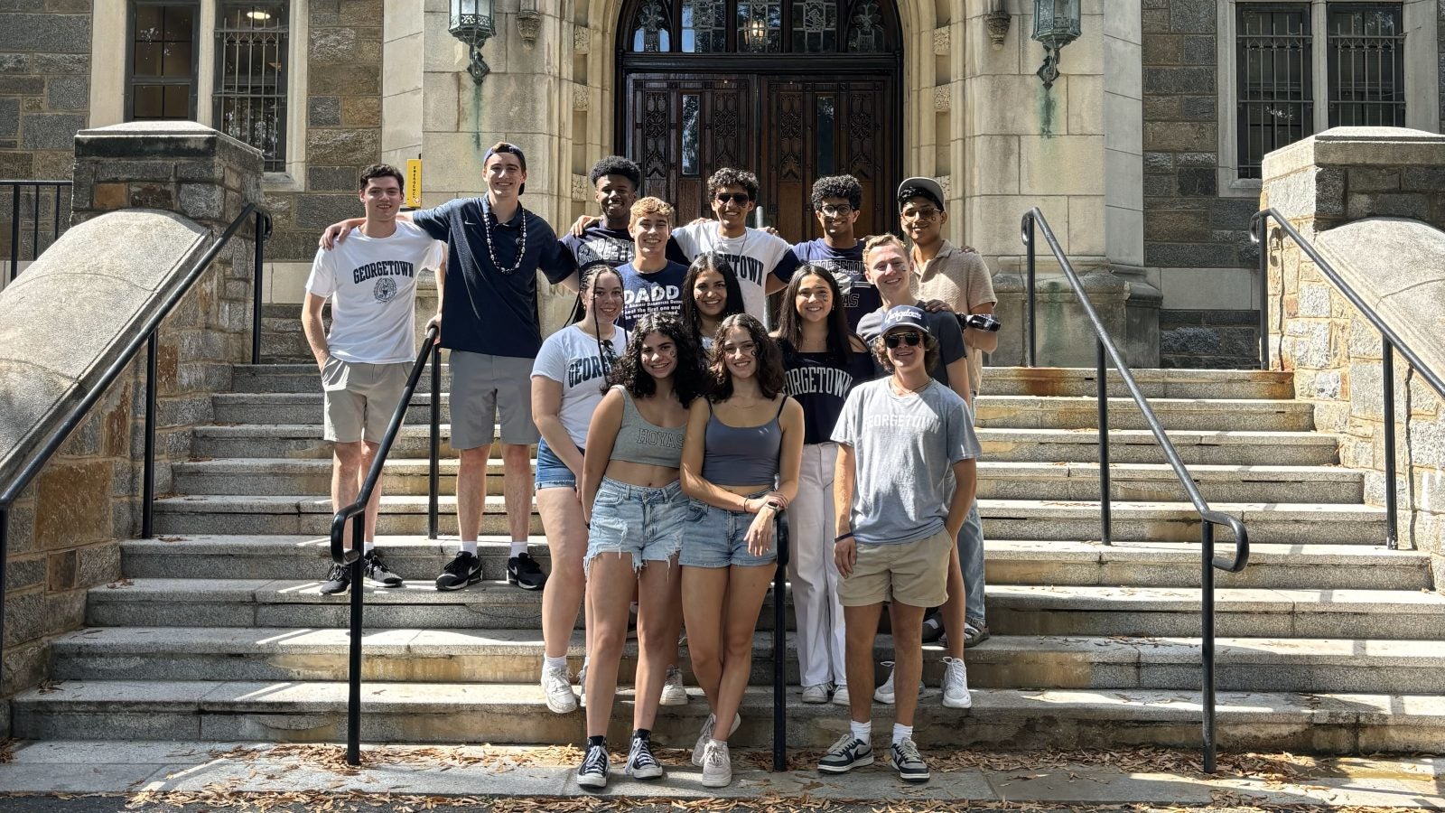 Justin Higgins with friends on the steps of Copley Hall