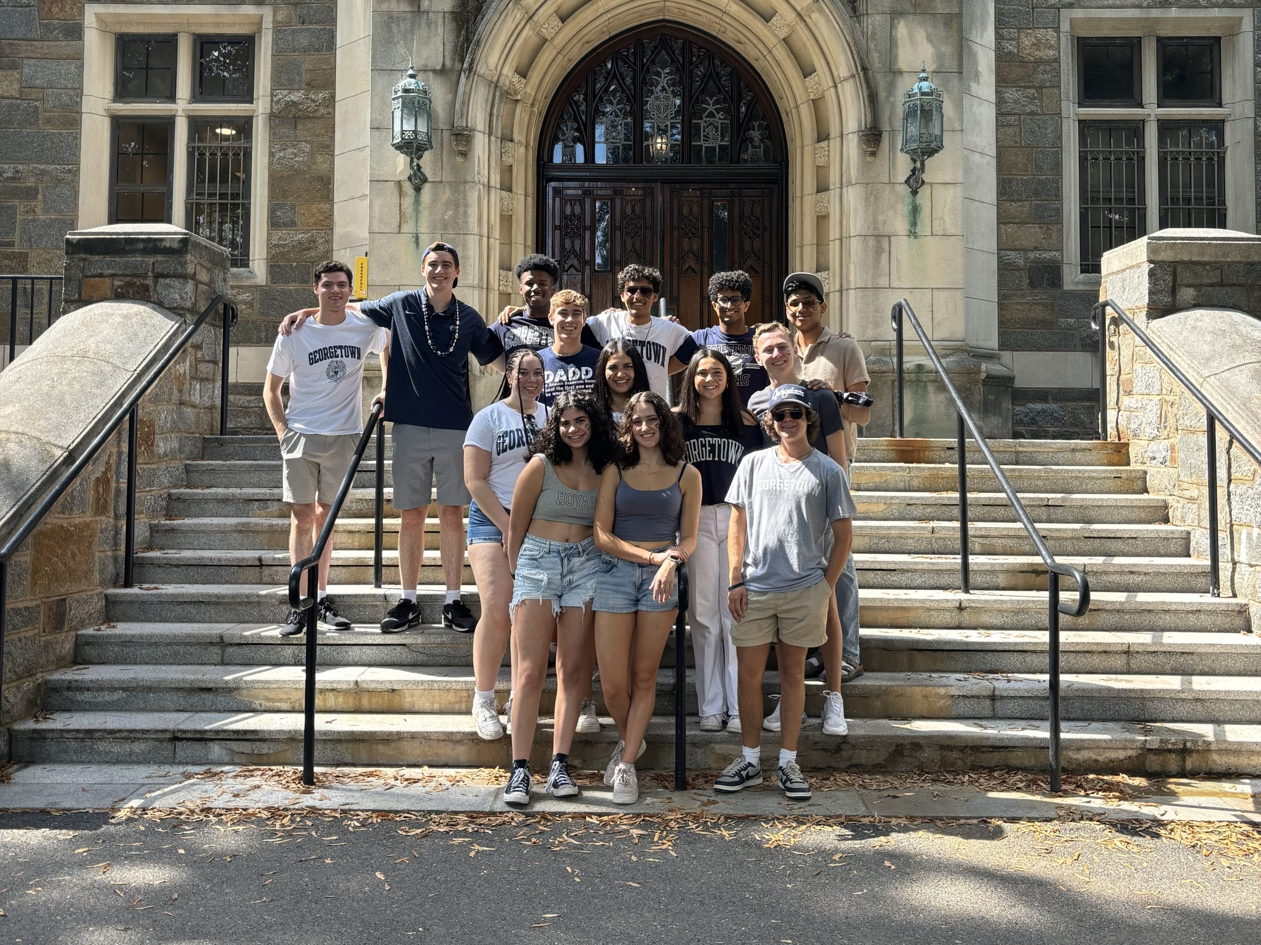 Justin Higgins with friends on the steps of Copley Hall