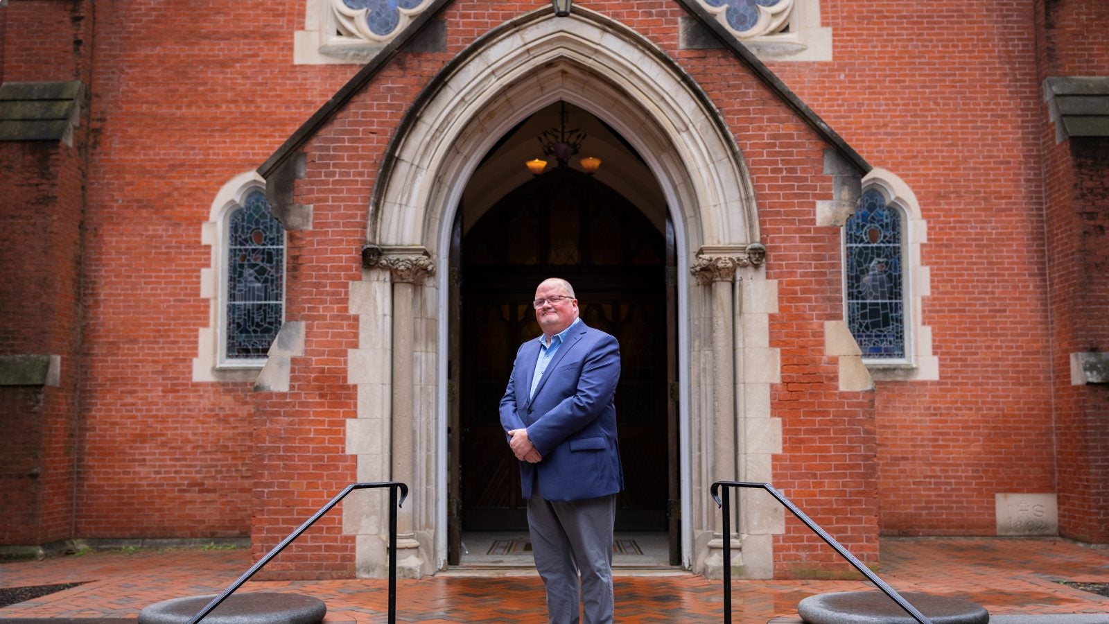 Wickman standing in front of Dahlgren Chapel