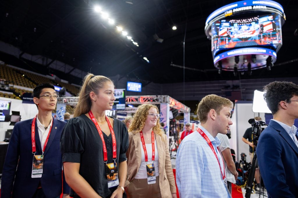 A group of students walk into a stadium at the Republican National Convention in July 2024.