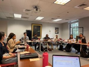 Students sitting around a table in a classroom