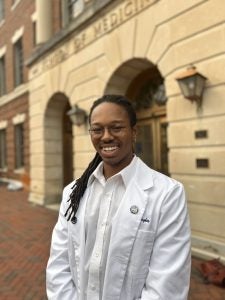 Hughes in his white coat