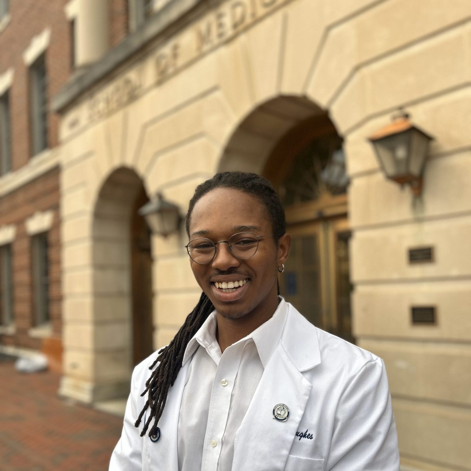 Hughes in his white coat