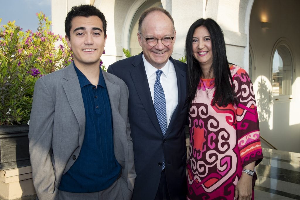 President DeGioia poses with his wife and son.