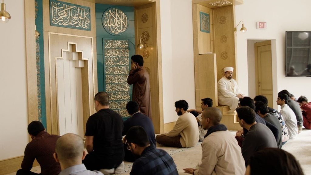 A group of community members worship in a masjid on Georgetown's campus.