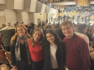 Four students at a concert hall