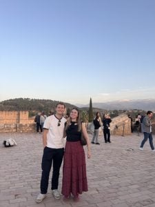 Young man and woman stand by the Alhambra