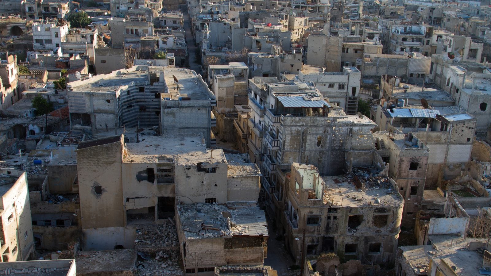 Homs, Syria in ruins with a lot of rubble on a sunny day