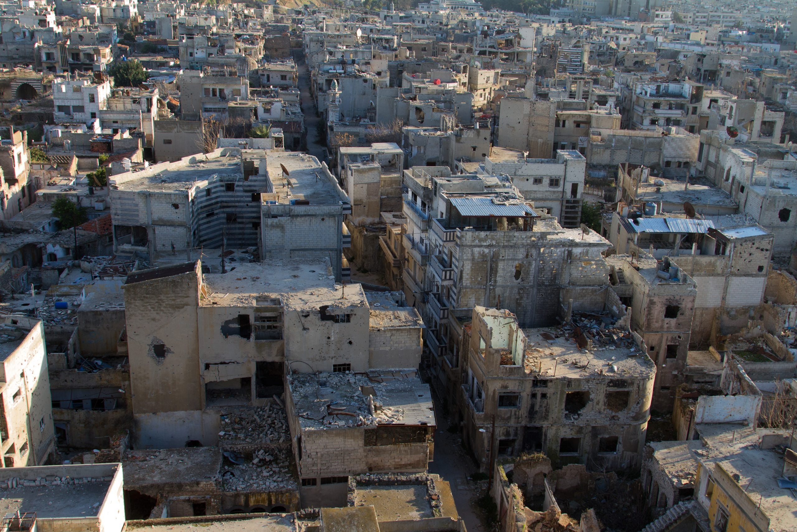 Homs, Syria in ruins with a lot of rubble on a sunny day