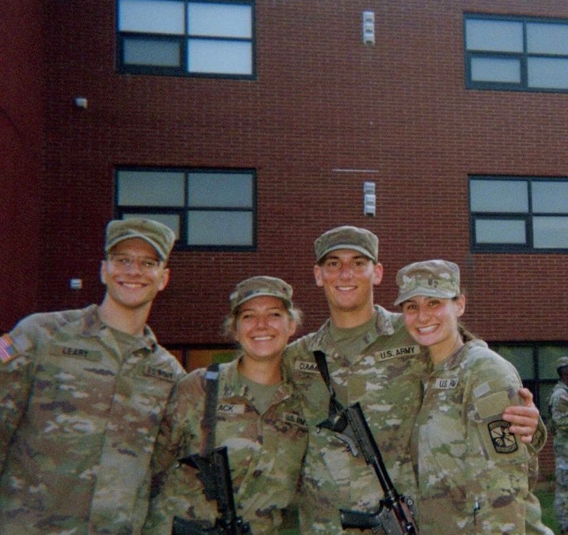 Four Army cadets in fatigues and caps