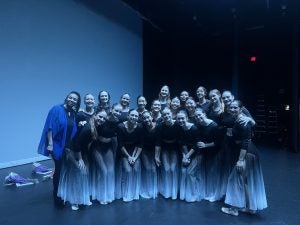 Young woman in dance costumes post for a photo