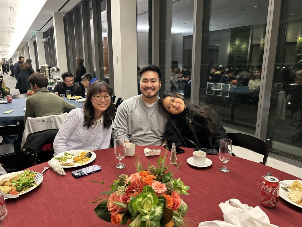 Three students at a table for Thanksgiving