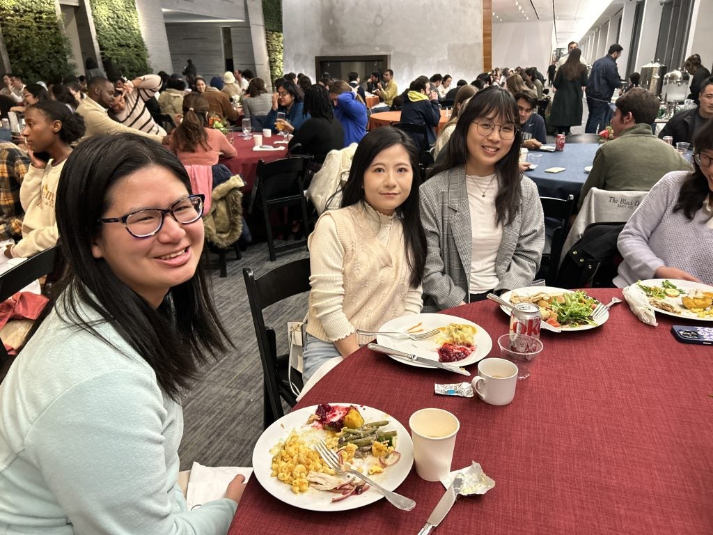 3 young women at a table for Thanksgiving