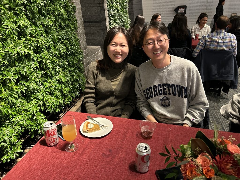 Two Asian students at a table for Thanksgiving