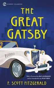 A blue book cover of a 1920s car and the title "The Great Gatsby"