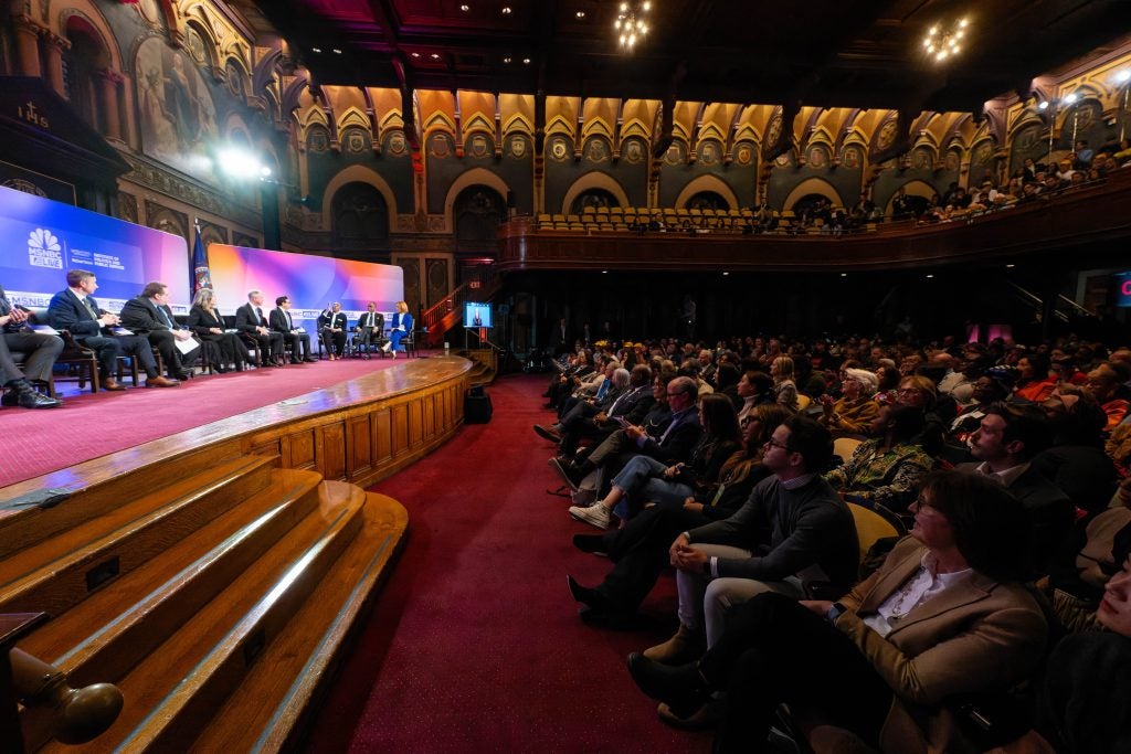 A crowd watches a candidate forum in Gaston hall