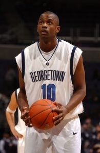 RaMell Ross with a basketball in a GU basketball jersey