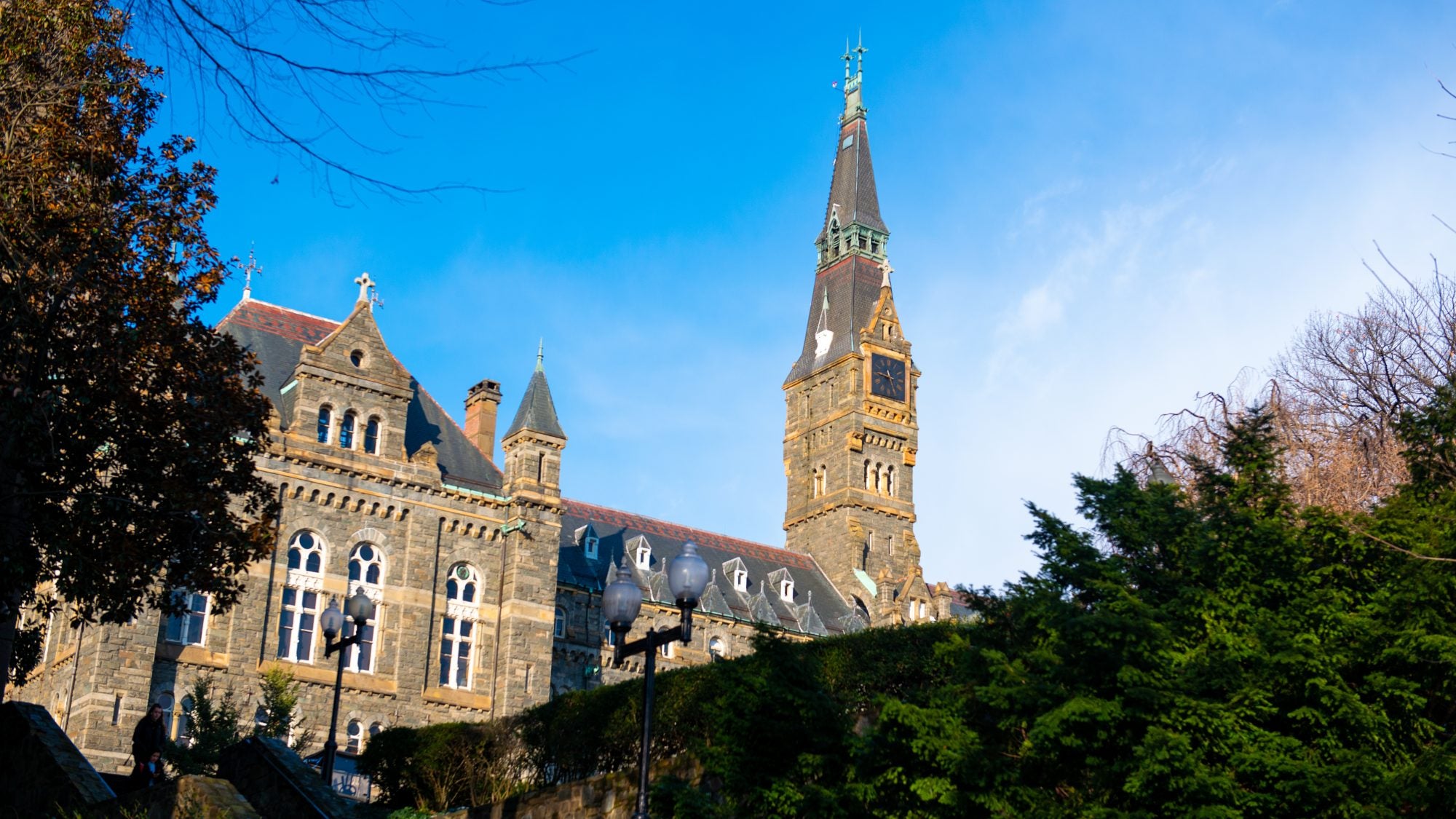 A clocktower against a blue sky on a winter morning