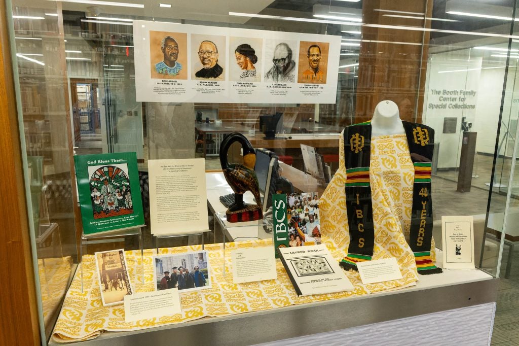 An exhibit in Georgetown's library features a case of different artifacts, images and materials from the Institute for Black Catholic Studies.