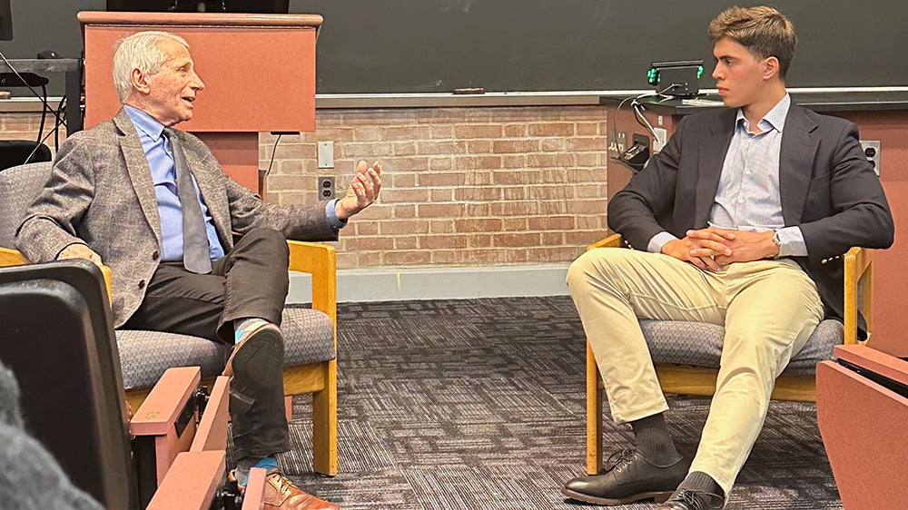 Dr. Fauci speaks to a student during a moderated discussion.