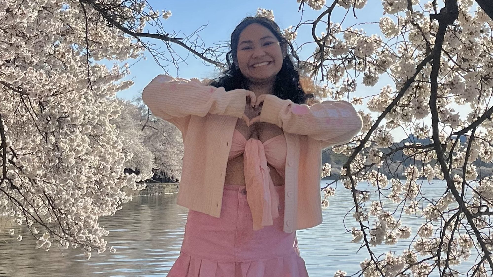 Mara in a pink outfit at the cherry blossoms in DC