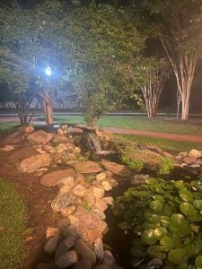 The koi pond in front of White Gravenor at night