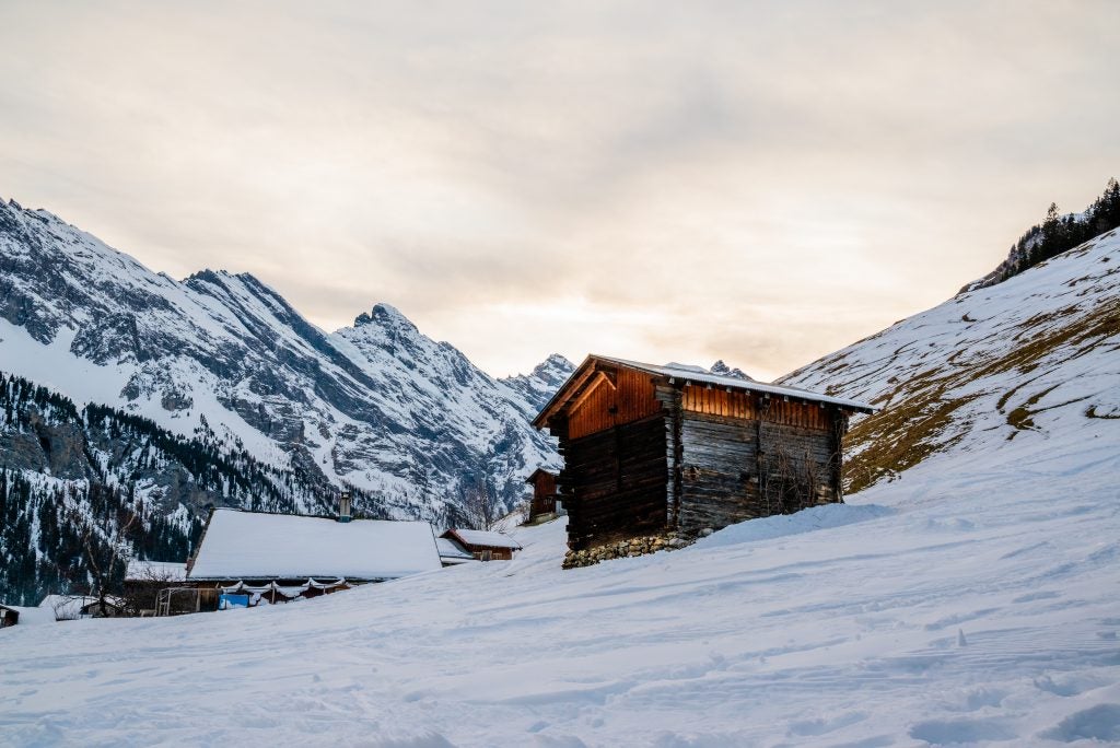 A building on a snowy mountain range