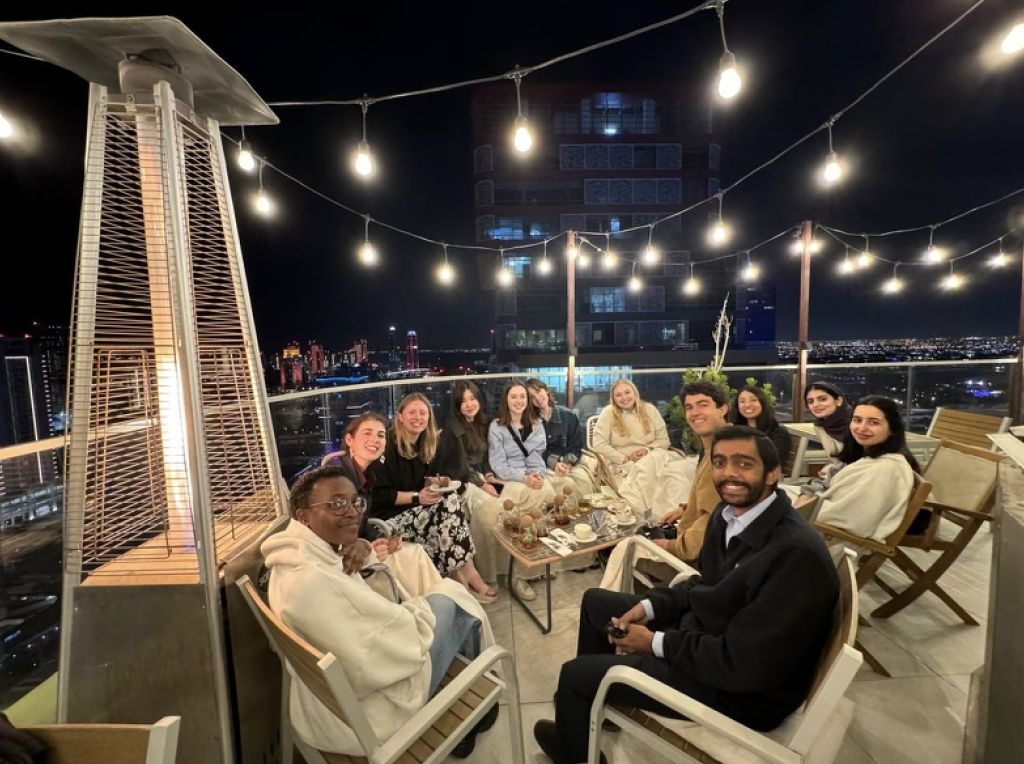 GU students on a terrace at night