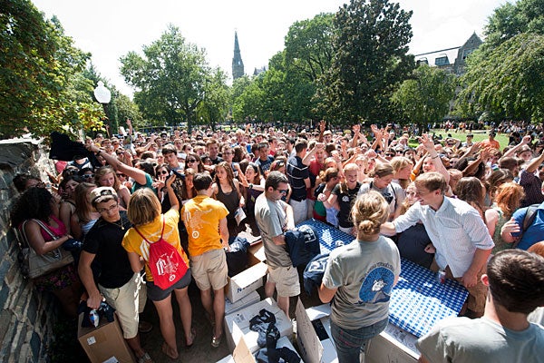 After feasting on hot dogs and hamburgers, students wait patiently to get a “Jack is Back” T-shirt on Copley Lawn.