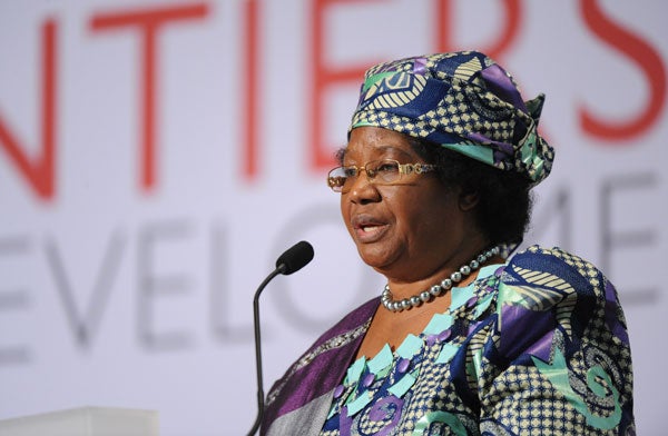 Joyce Banda speaks while seated in front of a backdrop