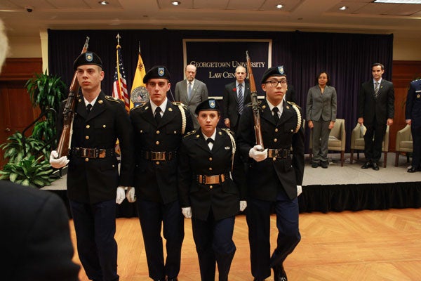 Members of the Hoya Battalion color guard march during the Law Center's Veterans Day program.